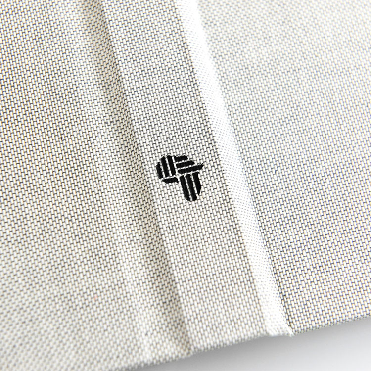 Linen hardbound book cover with embroidered logo